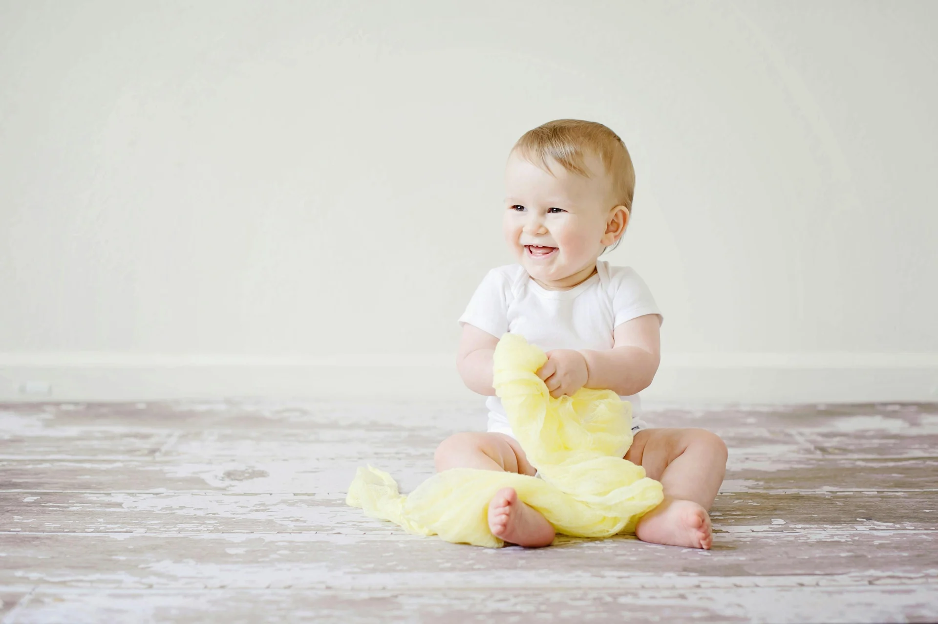 children stretching and laughing together in a warm bright studio